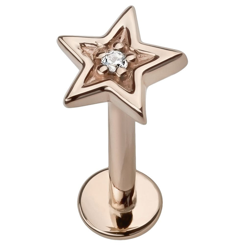 14k rose gold star flat back labret stud with center diamond, angled view showing warm pink tone