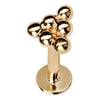14K yellow gold beaded triangle flat back labret stud, angled view showing clustered ball design and flat disc back