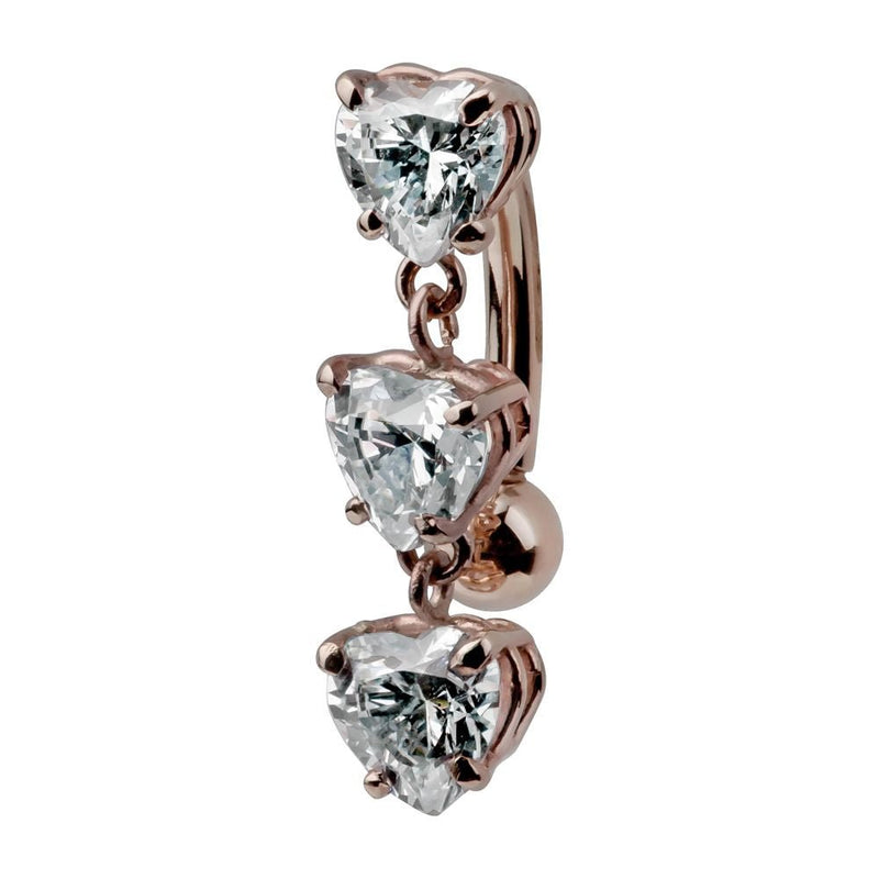 14K rose gold reverse navel ring featuring three heart-cut CZ charms in prong settings, side view