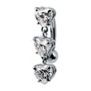 14K white gold reverse navel ring with three cascading heart-cut CZ charms, side view