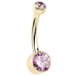 14K yellow gold belly ring with dual bezel-set pink CZ stones, angled side view