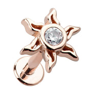 14K rose gold sunburst flat back labret stud with bezel-set CZ center, angled product view