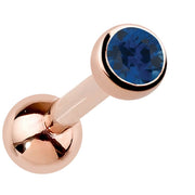 14k rose gold bezel-set sapphire cartilage earring with deep blue genuine gemstone, angled view