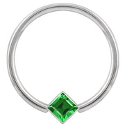 14k white gold fixed bead ring with green princess-cut CZ in corner bezel setting, front view