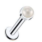 14k white gold flat back labret with 2mm pearl cabochon in bezel setting, angled product view