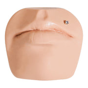 2mm diamond gold flat back labret stud shown in a Monroe or upper lip piercing on face mannequin