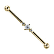 14K yellow gold industrial barbell with princess cut CZ center and two prong-set CZ side stones, front view