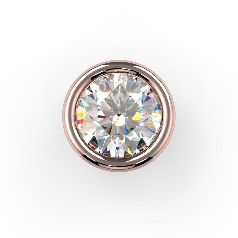 Top-down close-up of round diamond in 14K rose gold bezel setting highlighting stone brilliance and rosy gold surround