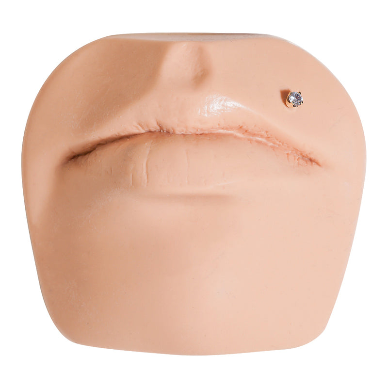 3mm CZ 14k rose gold flat back labret stud shown in Monroe lip piercing on silicone face model