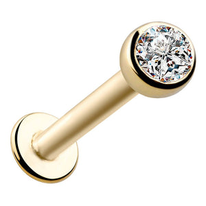 14k yellow gold flat back labret with 3mm CZ bezel setting, angled front view showing disc backing