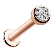 14k rose gold flat back labret with 3mm CZ bezel setting, angled front view showing warm tone finish