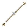 14K yellow gold triple CZ industrial barbell with detached threaded ends, close-up of prong-set CZ cluster