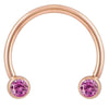 14k rose gold circular barbell with pink CZ bezel ends, smaller diameter showing warm gold tone