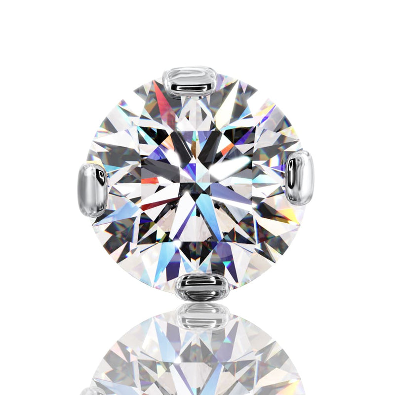 Top-down close-up of 4mm round diamond in four-prong setting showing full facet brilliance