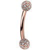 14K rose gold curved barbell with diamond pavé 4mm balls, warm blush tone side profile view