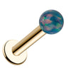 4mm teal synthetic opal flat back labret in 14k yellow gold, angled view showing post and disc