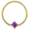14k yellow gold fixed bead ring with purple princess-cut CZ in corner-mount bezel, front view