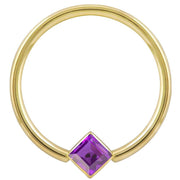 14k yellow gold fixed bead ring with purple princess-cut CZ in corner-mount bezel, front view