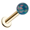 14k yellow gold flat back labret with 5mm iridescent teal synthetic opal ball, angled view