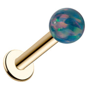 14k yellow gold flat back labret with 5mm iridescent teal synthetic opal ball, angled view