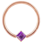 14k rose gold fixed bead ring with purple princess-cut CZ in corner-mount bezel, front view