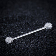 14K white gold diamond pavé straight barbell resting on dark textured surface, lifestyle shot