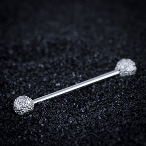 14K white gold diamond pavé straight barbell resting on dark textured surface, lifestyle shot