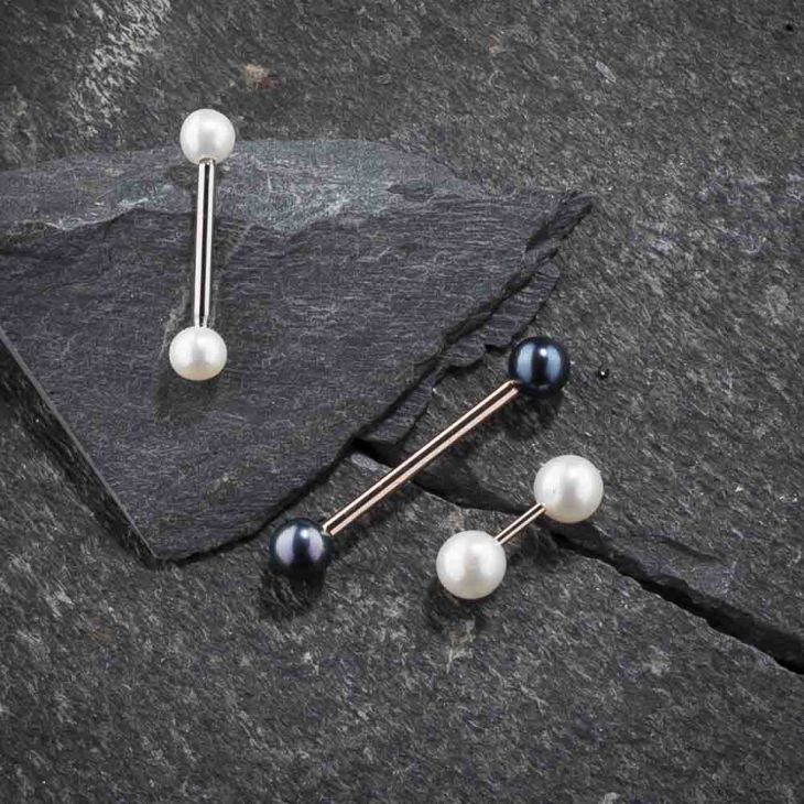 Pearl straight barbells on slate: white pearl in silver, mixed pearl in rose gold, shown for metal and style comparison