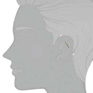 14K gold pearl industrial barbell shown in ear piercing on illustrated model for fit reference
