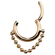14K rose gold clicker ring shown open, revealing hinged segment mechanism and bead chain