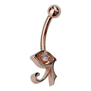 Side profile of 14k rose gold Eye of Horus navel ring highlighting CZ setting and Egyptian symbol charm