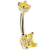 14k yellow gold belly ring with dual princess-cut citrine CZ stones in prong settings, angled front view