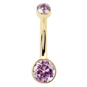 14K yellow gold Petite Bella belly ring with bezel-set pink CZ, front view showing stone size