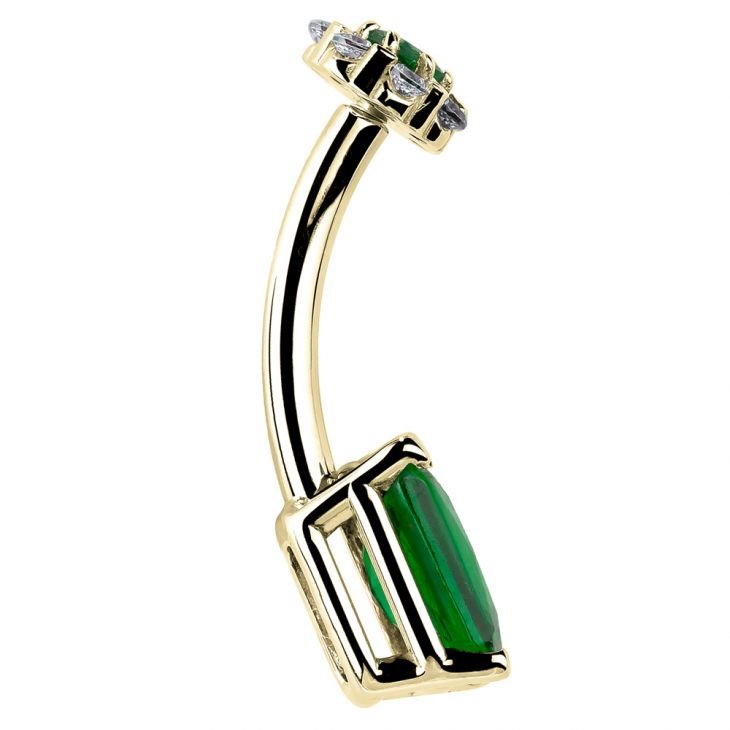 Side profile of 14k yellow gold belly ring showing curved barbell depth and green CZ setting edge