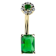 14k yellow gold navel ring with emerald cut green CZ bottom and white CZ daisy flower top, front view