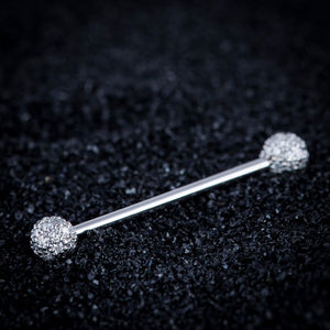 14k white gold diamond pavé straight barbell resting on dark textured surface, angled lifestyle shot
