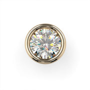 Top-down close-up of round diamond in 14K yellow gold bezel setting showcasing brilliant cut and warm gold rim