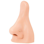 14k yellow gold tiny triangle flat back stud worn in nose piercing on silicone nose model