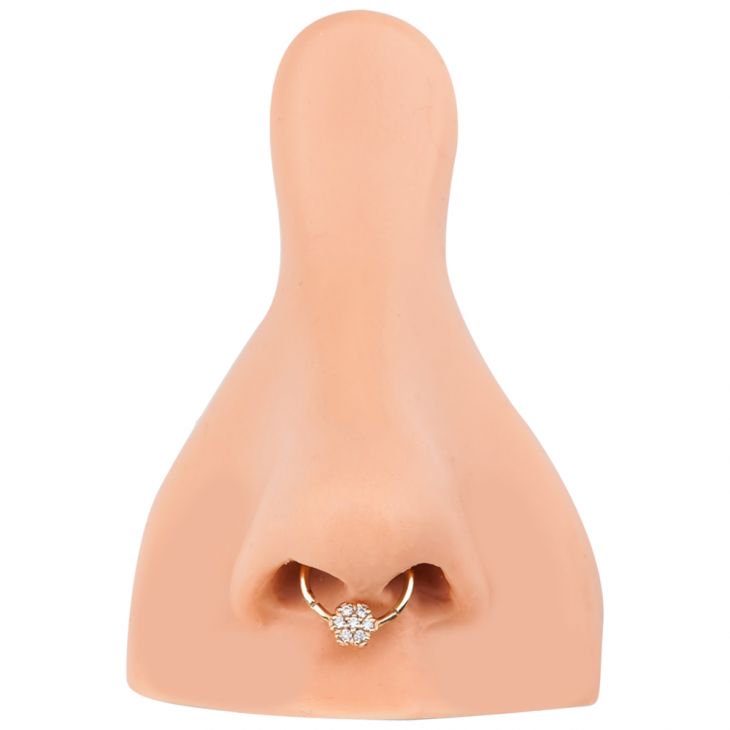 14K gold diamond flower clicker ring worn as septum ring on nose model for fit reference
