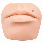 2mm blue diamond bezel-set 14k gold flat back labret shown in lip piercing on silicone face model