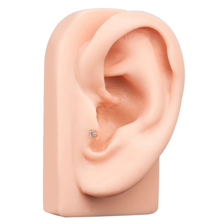 3mm diamond flat back labret stud shown in tragus piercing on silicone ear display model