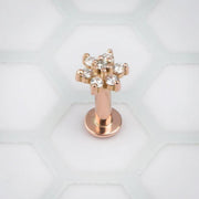 14k rose gold CZ flower flat back labret, front view showing clear CZ charm on white hexagon background