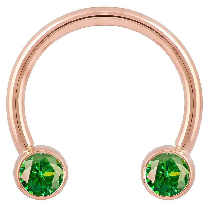 14k rose gold circular barbell with dual green CZ bezel ends, larger diameter front view