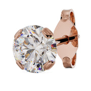 4mm round diamond stud in 14k rose gold low-set prong setting, angled view showing post and backing
