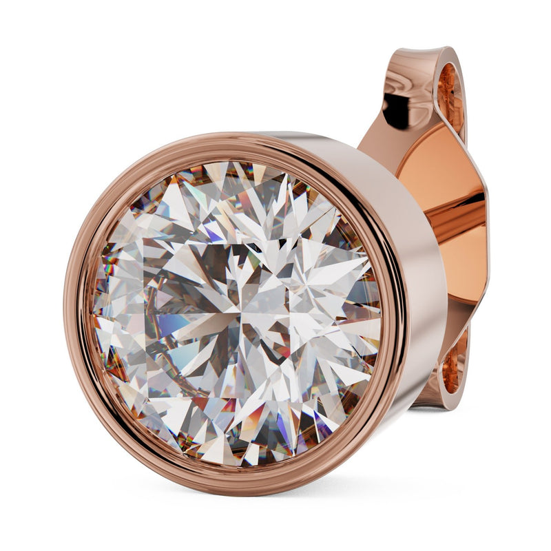 Angled close-up of 4mm .25ct diamond bezel-set stud earring in 14k rose gold with post visible
