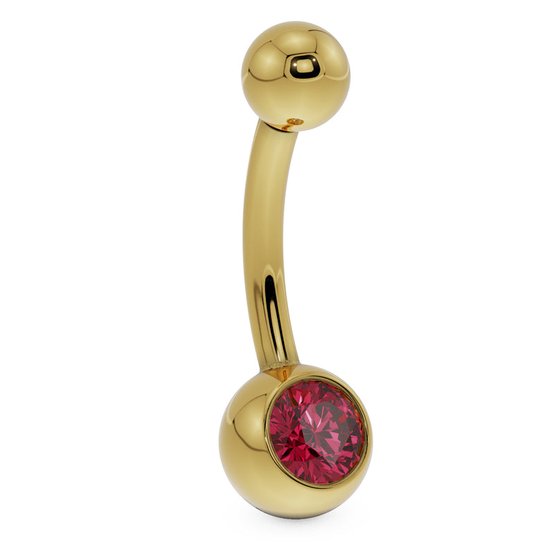 Side profile of 14K yellow gold belly button ring with red CZ bezel ball setting