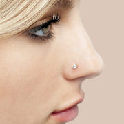3mm diamond bezel nose stud shown in pierced nostril on model, side profile for fit reference