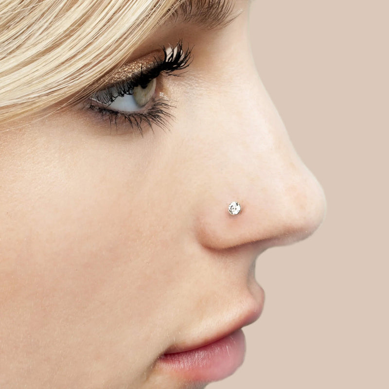 3mm diamond bezel flat back labret stud worn in nose piercing on model, side profile view
