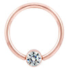 14K rose gold fixed bead ring with bezel-set round diamond, front view