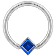 14k white gold fixed bead ring with large blue princess-cut CZ corner bezel, close-up front view
